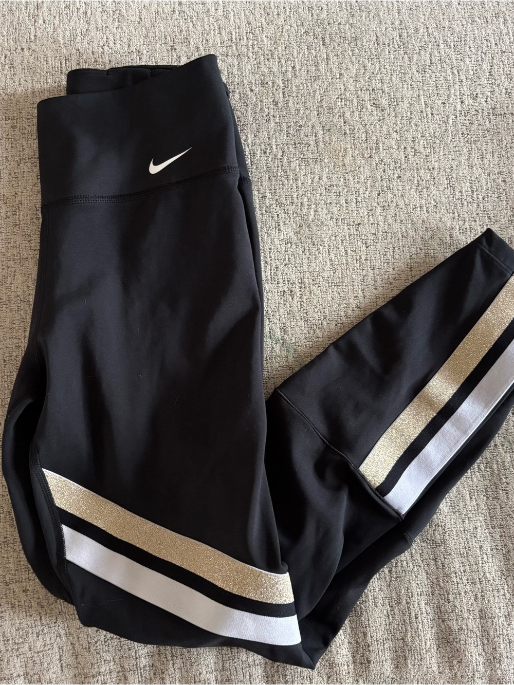 Nike black leggings with metallic stripes